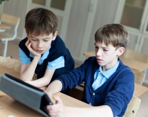 student and tablet in classroom