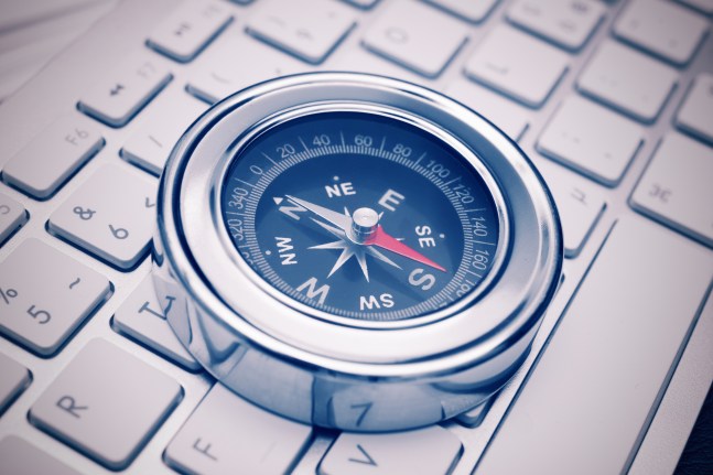 Compass on a keyboard. Internet search concept